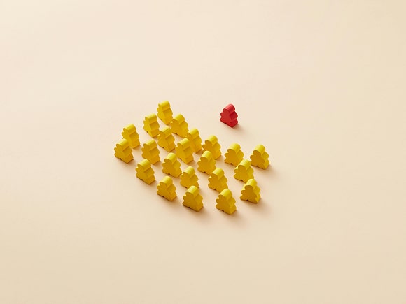 One red person icon in front of a crowd of yellow